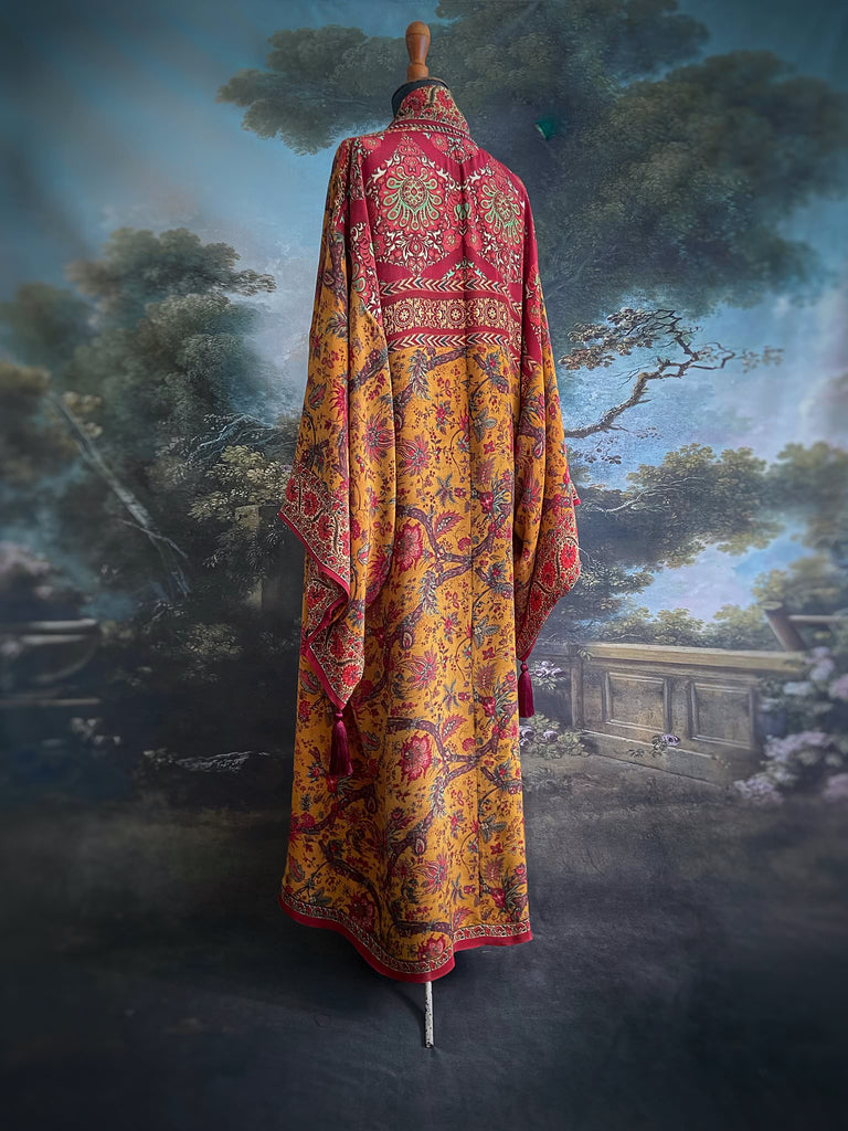 Full length 1920s inspired kimono robe with large patch pockets. Newly created from a saffron and ruby vintage silk crepe. Fully lined in silk with French seams throughout. Bohemian styles sustainably created from antique and vintage textiles by the Pavilion Parade studio.