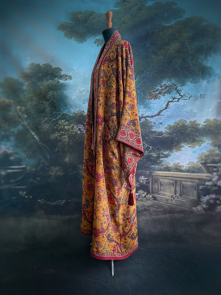 Full length 1920s inspired kimono robe with large patch pockets. Newly created from a saffron and ruby vintage silk crepe. Fully lined in silk with French seams throughout. Bohemian styles sustainably created from antique and vintage textiles by the Pavilion Parade studio.