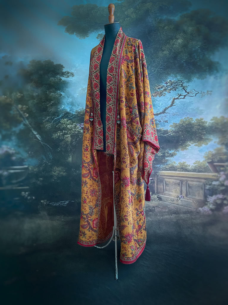 Full length 1920s inspired kimono robe with large patch pockets. Newly created from a saffron and ruby vintage silk crepe. Fully lined in silk with French seams throughout. Bohemian styles sustainably created from antique and vintage textiles by the Pavilion Parade studio.