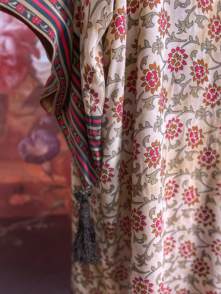 Full length 1920s inspired kimono robe with large patch pockets. Newly created from a red, black and stone vintage silk crepe. Fully lined in silk with French seams throughout. Bohemian styles sustainably created from antique and vintage textiles by the Pavilion Parade studio.