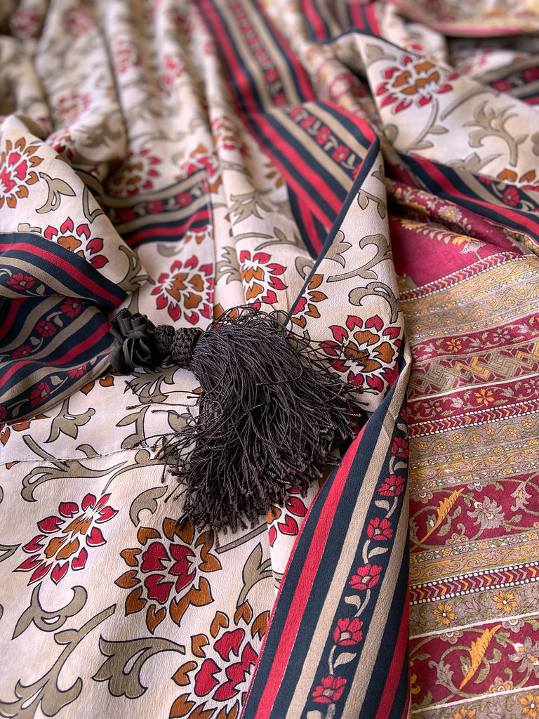 Full length 1920s inspired kimono robe with large patch pockets. Newly created from a red, black and stone vintage silk crepe. Fully lined in silk with French seams throughout. Bohemian styles sustainably created from antique and vintage textiles by the Pavilion Parade studio.