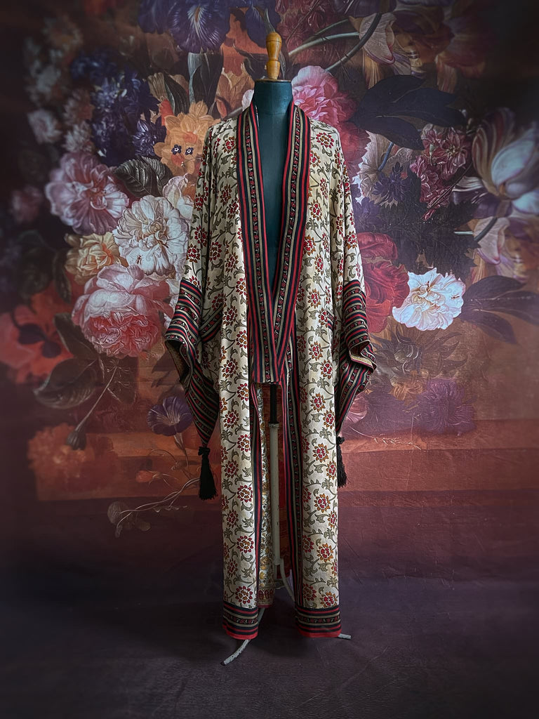 Full length 1920s inspired kimono robe with large patch pockets. Newly created from a red, black and stone vintage silk crepe. Fully lined in silk with French seams throughout. Bohemian styles sustainably created from antique and vintage textiles by the Pavilion Parade studio.