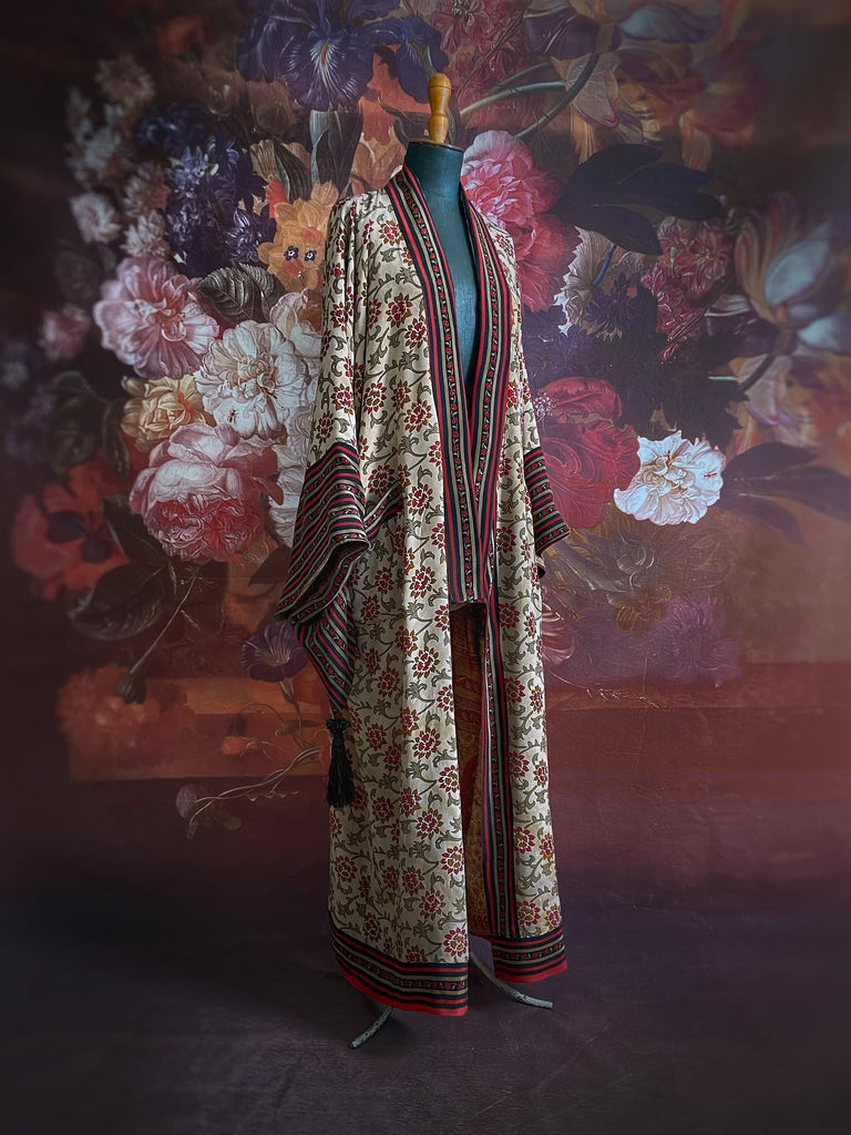 Full length 1920s inspired kimono robe with large patch pockets. Newly created from a red, black and stone vintage silk crepe. Fully lined in silk with French seams throughout. Bohemian styles sustainably created from antique and vintage textiles by the Pavilion Parade studio.
