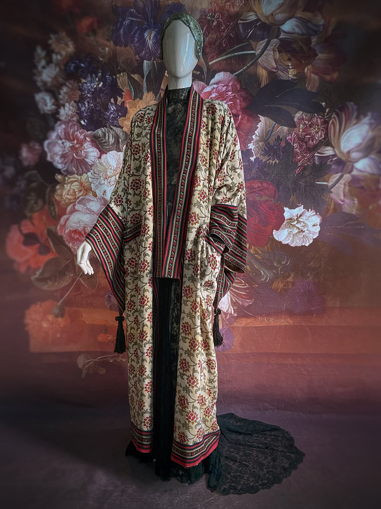 Full length 1920s inspired kimono robe with large patch pockets. Newly created from a red, black and stone vintage silk crepe. Fully lined in silk with French seams throughout. Bohemian styles sustainably created from antique and vintage textiles by the Pavilion Parade studio.