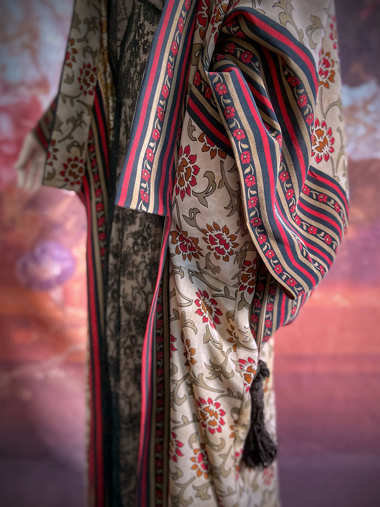 Full length 1920s inspired kimono robe with large patch pockets. Newly created from a red, black and stone vintage silk crepe. Fully lined in silk with French seams throughout. Bohemian styles sustainably created from antique and vintage textiles by the Pavilion Parade studio.