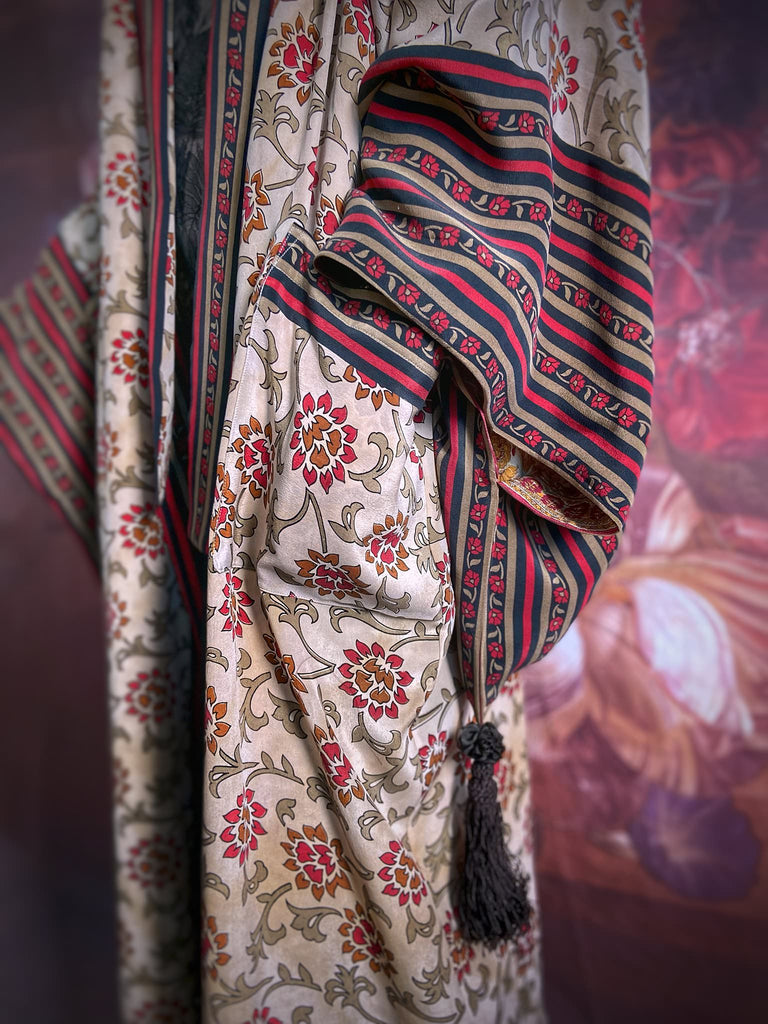 Full length 1920s inspired kimono robe with large patch pockets. Newly created from a red, black and stone vintage silk crepe. Fully lined in silk with French seams throughout. Bohemian styles sustainably created from antique and vintage textiles by the Pavilion Parade studio.