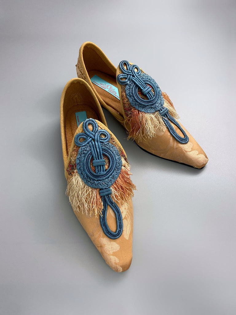 Apricot silk damask pointed toe shoes with 18th century silk tassel fringe and faded blue soutache frogging. Bohemian styles created from antique textiles by the Pavilion Parade studio.
