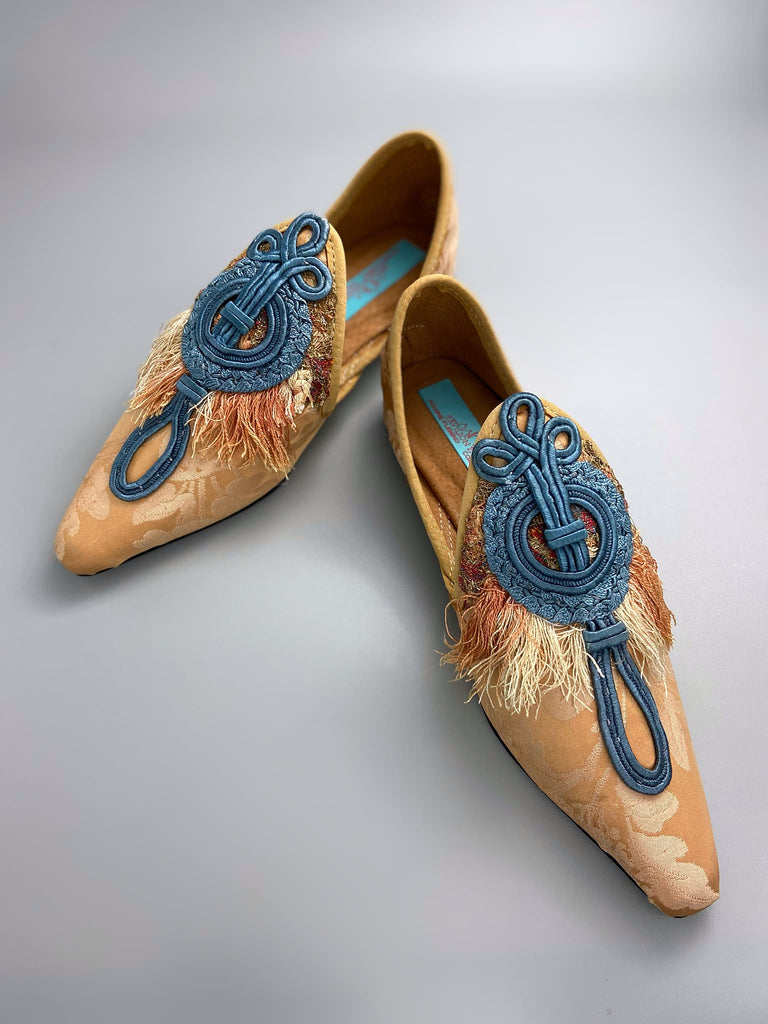 Apricot silk damask pointed toe shoes with 18th century silk tassel fringe and faded blue soutache frogging. Bohemian styles created from antique textiles by the Pavilion Parade studio.