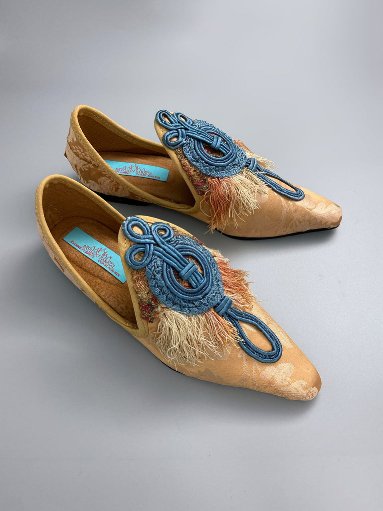 Apricot silk damask pointed toe shoes with 18th century silk tassel fringe and faded blue soutache frogging. Bohemian styles created from antique textiles by the Pavilion Parade studio.