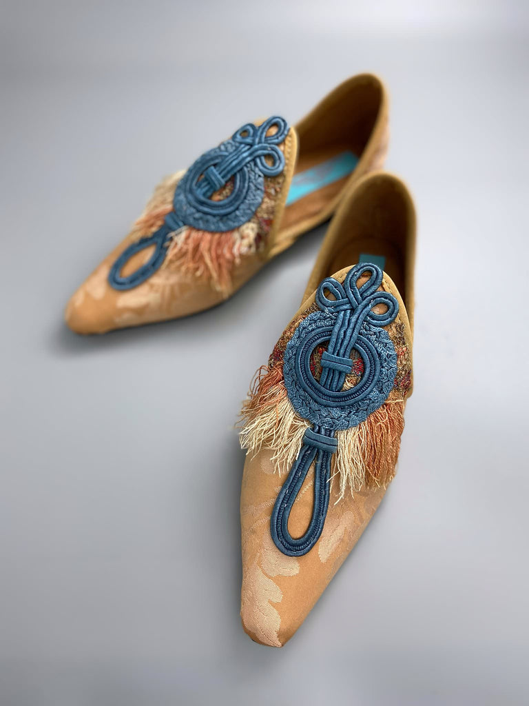 Apricot silk damask pointed toe shoes with 18th century silk tassel fringe and faded blue soutache frogging. Bohemian styles created from antique textiles by the Pavilion Parade studio.