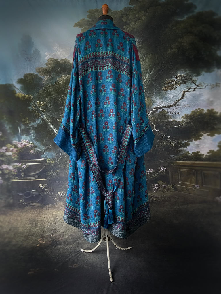 Teal blue, claret red and aqua fine wool dressing robe with wide sleeves, pockets and tassel sash. Lined in block printed silk. Bohemian styles created from antique and vintage textiles by the Pavilion Parade studio.
