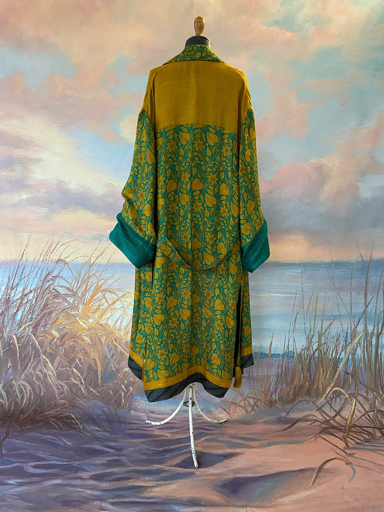 Teal and turmeric yellow silk-lined fine wool dressing robe or duster coat with wide sleeves, pockets and tassel tie sash. Bohemian styles created from antique and vintage textiles by the Pavilion Parade studio.