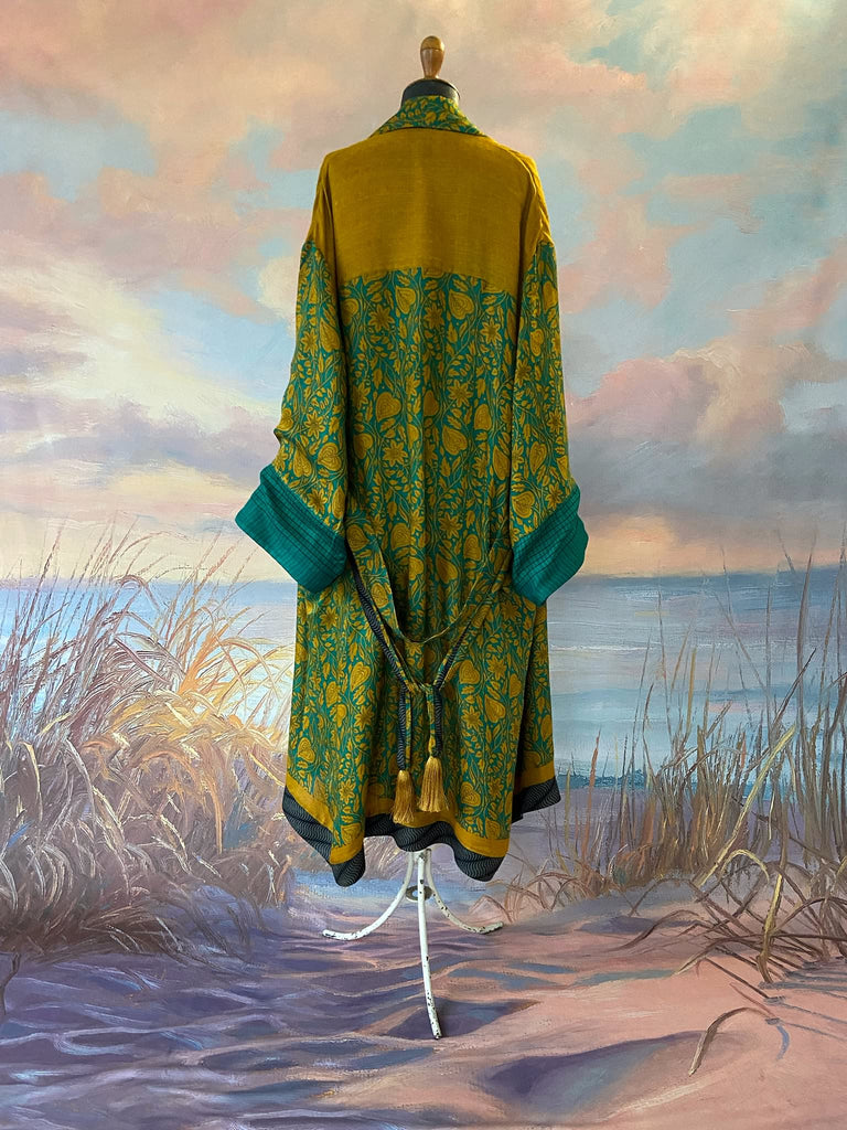 Teal and turmeric yellow silk-lined fine wool dressing robe or duster coat with wide sleeves, pockets and tassel tie sash. Bohemian styles created from antique and vintage textiles by the Pavilion Parade studio.