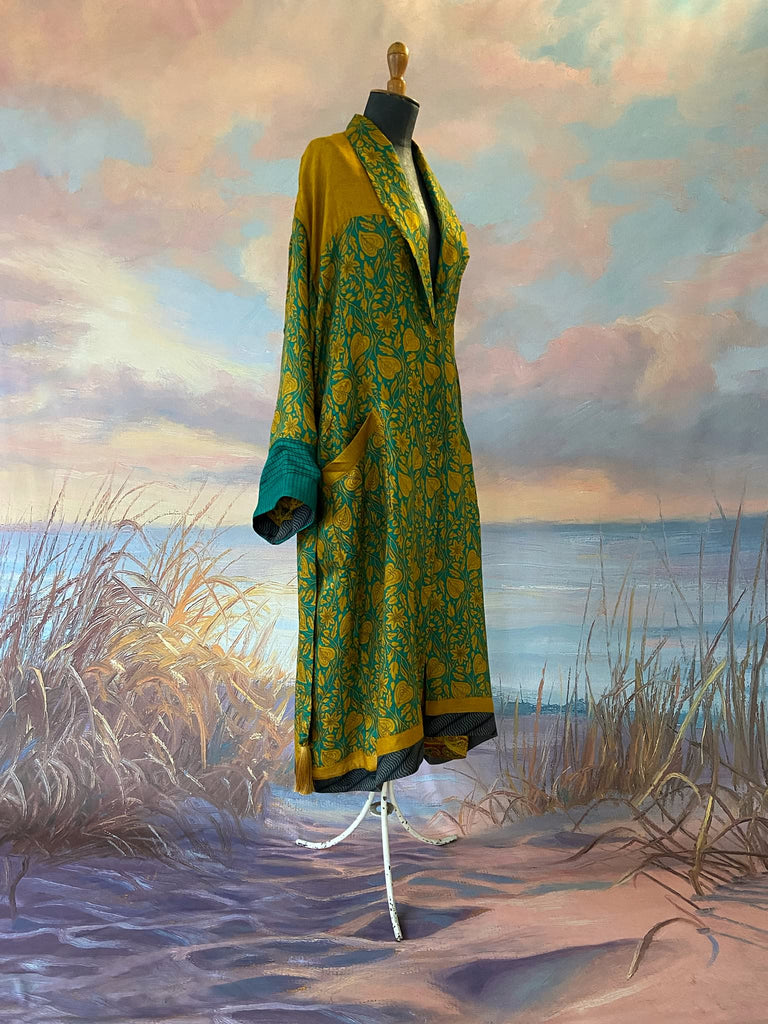 Teal and turmeric yellow silk-lined fine wool dressing robe or duster coat with wide sleeves, pockets and tassel tie sash. Bohemian styles created from antique and vintage textiles by the Pavilion Parade studio.