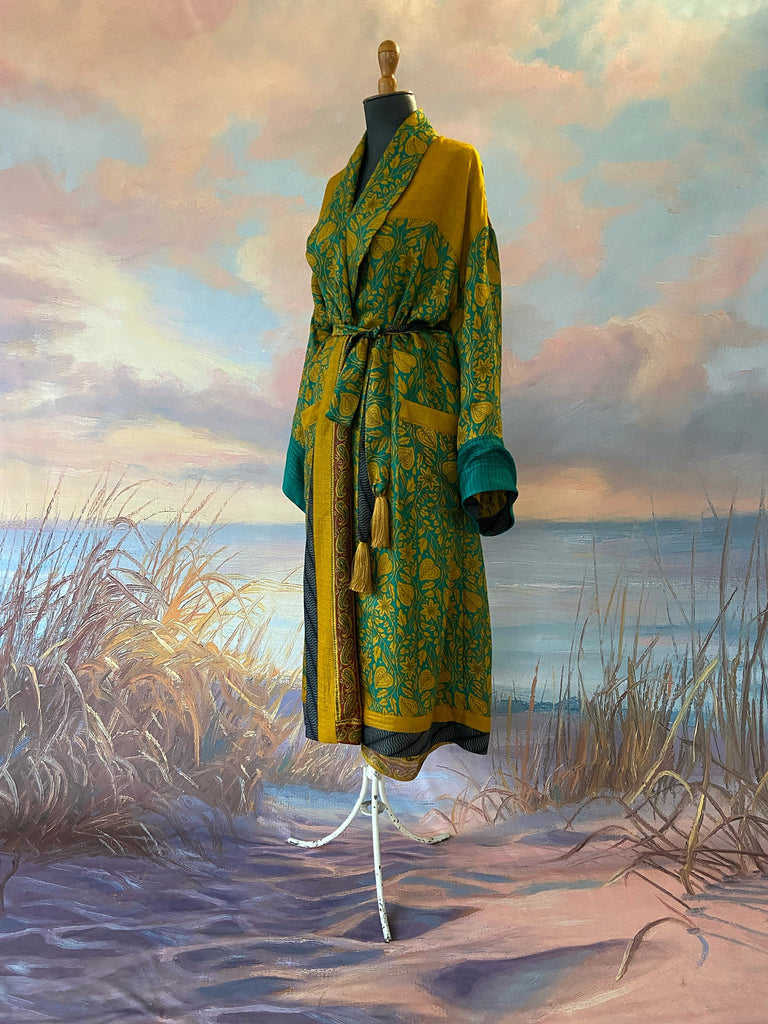 Teal and turmeric yellow silk-lined fine wool dressing robe or duster coat with wide sleeves, pockets and tassel tie sash. Bohemian styles created from antique and vintage textiles by the Pavilion Parade studio.