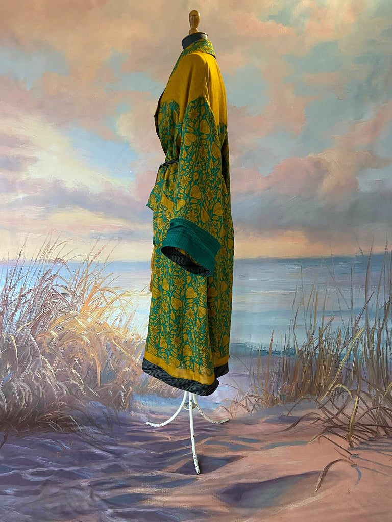 Teal and turmeric yellow silk-lined fine wool dressing robe or duster coat with wide sleeves, pockets and tassel tie sash. Bohemian styles created from antique and vintage textiles by the Pavilion Parade studio.