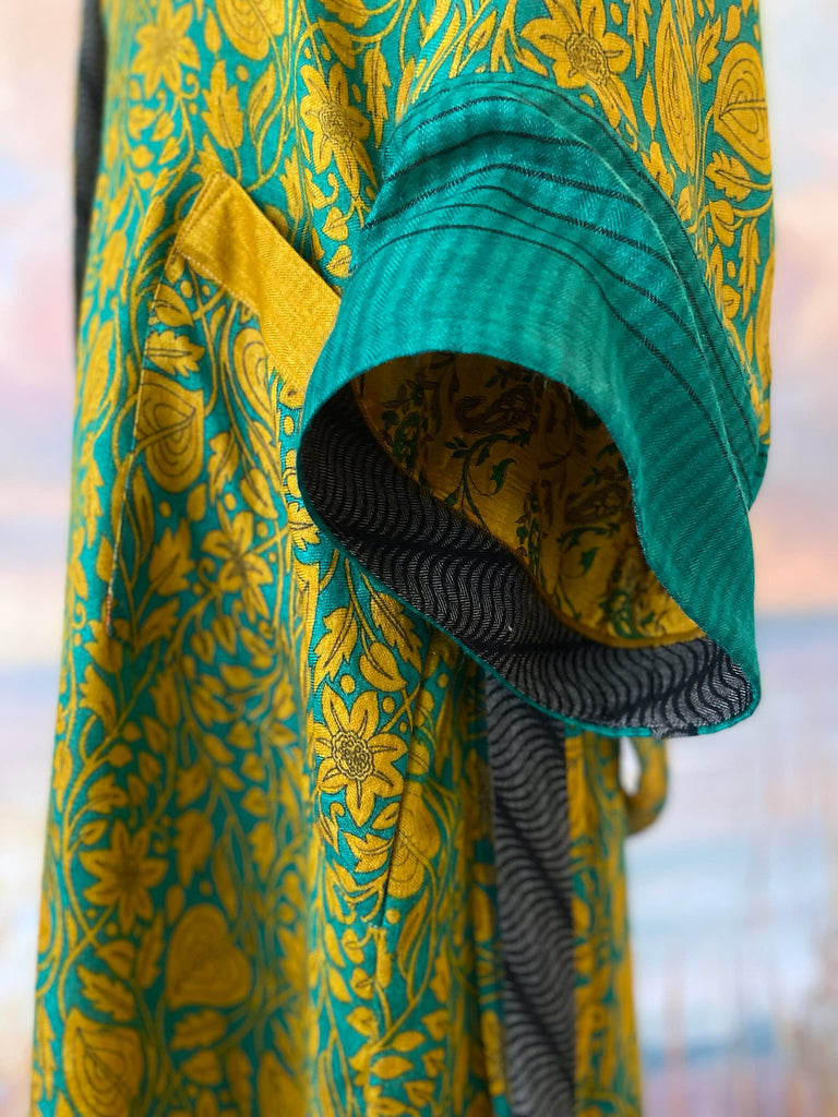 Teal and turmeric yellow silk-lined fine wool dressing robe or duster coat with wide sleeves, pockets and tassel tie sash. Bohemian styles created from antique and vintage textiles by the Pavilion Parade studio.