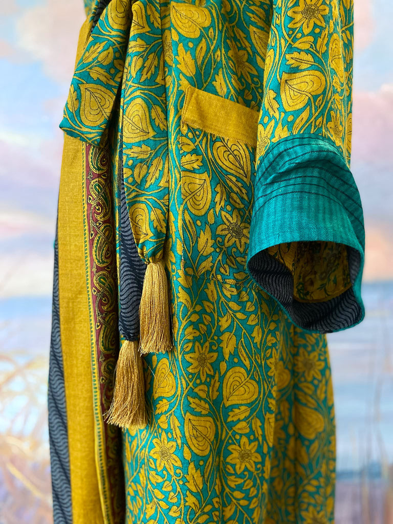 Teal and turmeric yellow silk-lined fine wool dressing robe or duster coat with wide sleeves, pockets and tassel tie sash. Bohemian styles created from antique and vintage textiles by the Pavilion Parade studio.