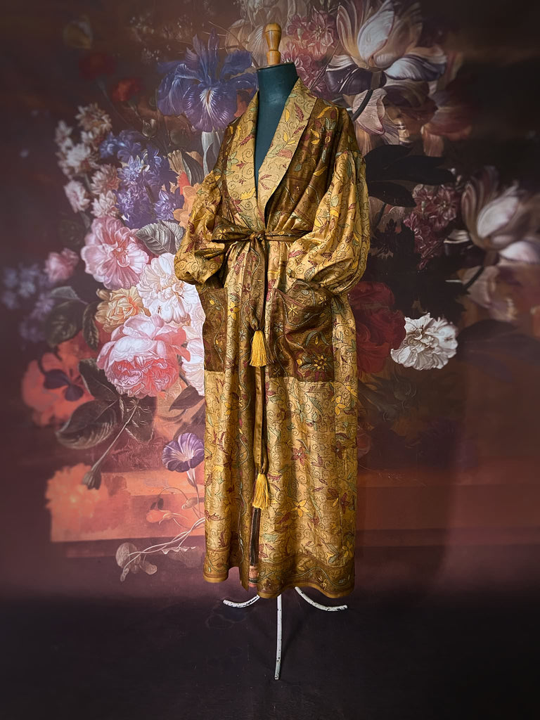 Toffee and caramel hand embroidered kantha silk robe with full sleeves, oversize pockets and tassel sash. Fully lined in silk, and sustainably created from antique and vintage textiles by the Pavilion Parade studio.