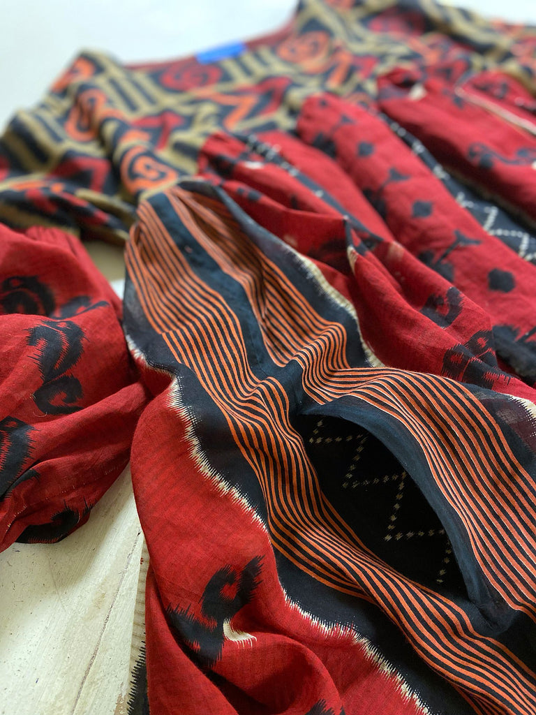 Artistic Dress inspired scarlet and black ikat printed Indian cotton muslin dress  with balloon sleeves, pockets, and integral tiered petticoat. Bohemian style sustainably created from vintage and antique textiles by the Pavilion Parade studio. 