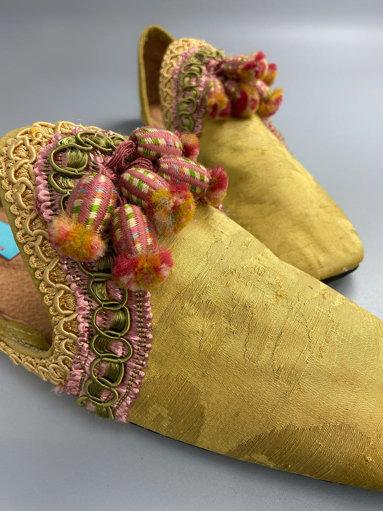 Golden yellow antique silk shoes with pink silk tassels and passementerie braid embellishment. Bohemian styles by Pavilion Parade