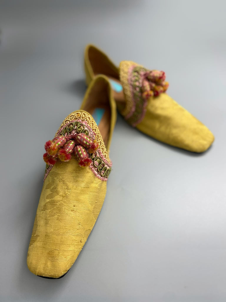 Golden yellow antique silk shoes with pink silk tassels and passementerie braid embellishment. Bohemian styles by Pavilion Parade