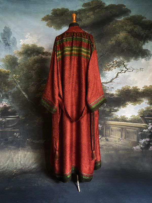 Rust red and green fine wool robe with colourful silk lining. Sustainaly created from vintage and antique textiles by the Pavilion Parade studio