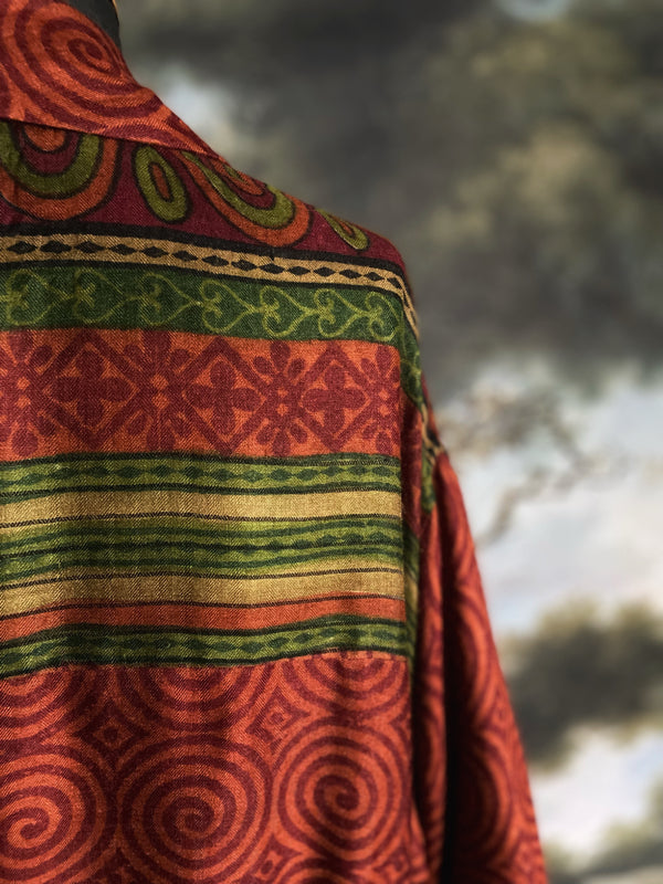 Rust red and green fine wool robe with colourful silk lining. Sustainaly created from vintage and antique textiles by the Pavilion Parade studio