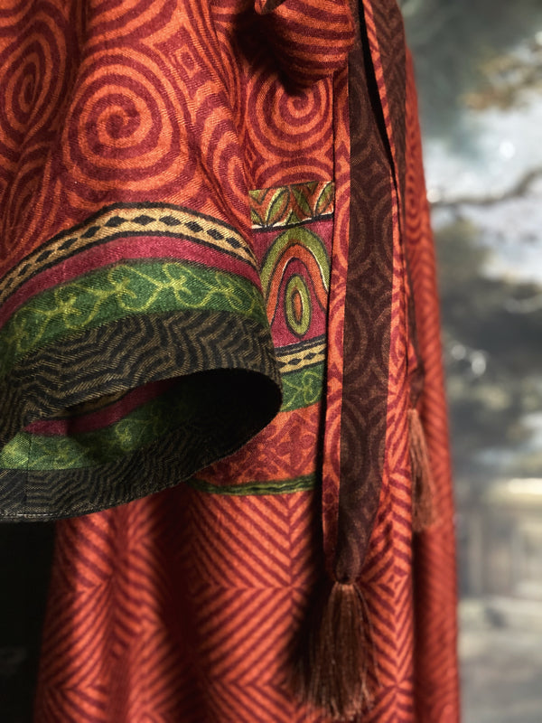 Rust red and green fine wool robe with colourful silk lining. Sustainaly created from vintage and antique textiles by the Pavilion Parade studio