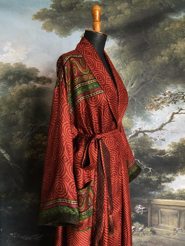 Rust red and green fine wool robe with colourful silk lining. Sustainaly created from vintage and antique textiles by the Pavilion Parade studio