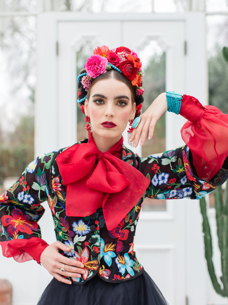 Frida Kahlo inspired embroidered silk and tulle bodice jacket with picture neckline and pagoda sleeves. Vivid black, red, green and blue floral. Flight of fancy from the Pavilion Parade studio. 