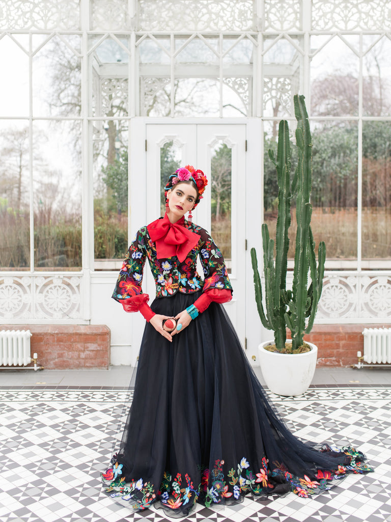 Frida Kahlo inspired embroidered silk and tulle bodice jacket with picture neckline and pagoda sleeves. Vivid black, red, green and blue floral. Flight of fancy from the Pavilion Parade studio. 