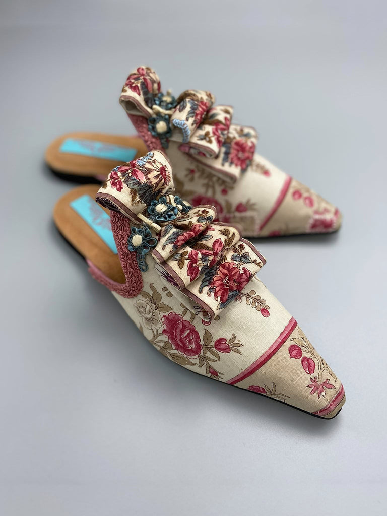 Pompadour Marie Antoinette inspired shoes created from antique early 1800s rose pink and ivory block printed French cotton toile and embellished in blue silk passementerie rosettes. Bohemian style from the Pavilion Parade studio.