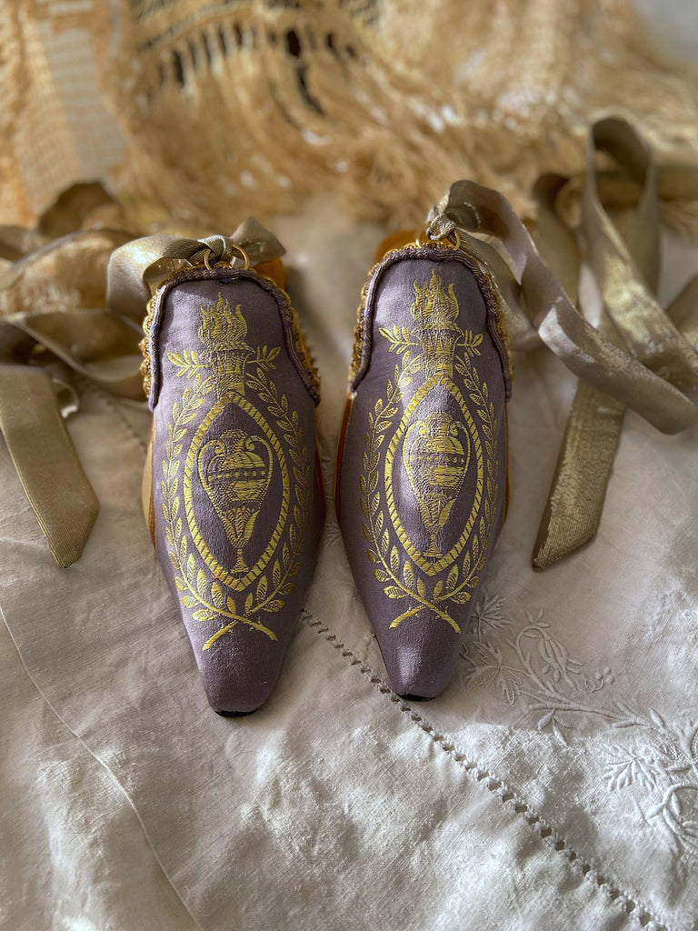 Pavilion Parade handmade shoes created from antique textiles,  available from Joanne Fleming Design. Antique neo-classical brocade and 19th century passementerie create bohemian flat shoes in shades of lavender and gold.