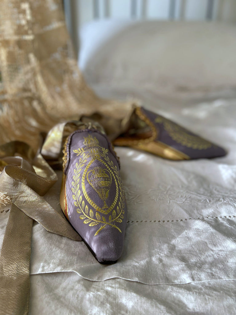 Pavilion Parade handmade shoes created from antique textiles,  available from Joanne Fleming Design. Antique neo-classical brocade and 19th century passementerie create bohemian flat shoes in shades of lavender and gold.