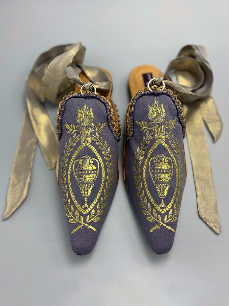 Pavilion Parade handmade shoes created from antique textiles,  available from Joanne Fleming Design. Antique neo-classical brocade and 19th century passementerie create bohemian flat shoes in shades of lavender and gold.