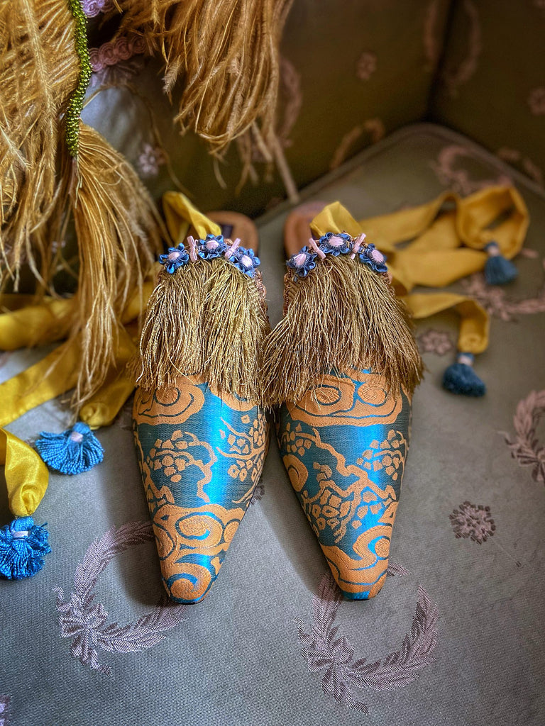 Belle Epoque antique silk in the Japanese style is used to create pointed toe bohemian shoes with tassels and silk ankle ties. Teal blue and gold palette.