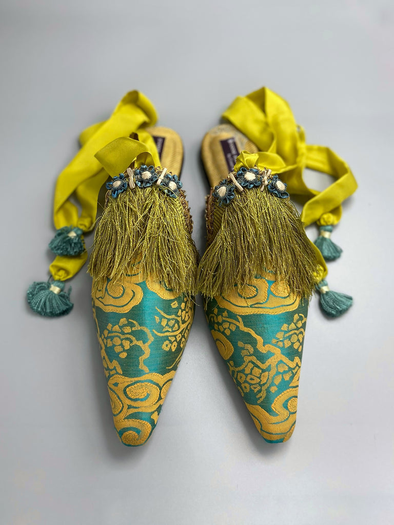 Belle Epoque antique silk in the Japanese style is used to create pointed toe bohemian shoes with tassels and silk ankle ties. Teal blue and gold palette.