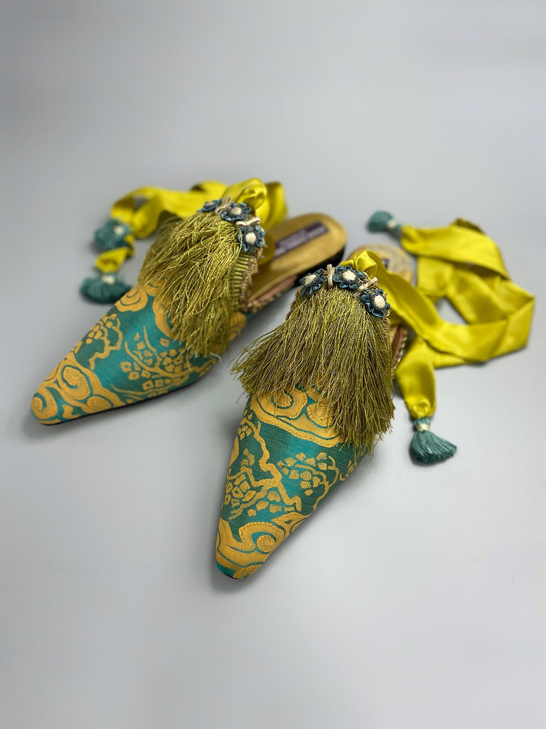 Belle Epoque antique silk in the Japanese style is used to create pointed toe bohemian shoes with tassels and silk ankle ties. Teal blue and gold palette.