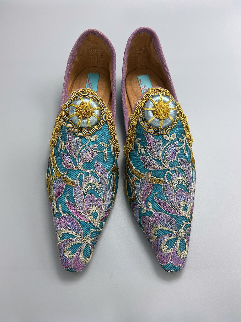 Pointed toe shoes created from antique lilac and gold lace over azure blue silk, with gold braid and vintage Passementerie rosette embellishment. Created by Pavilion Parade.