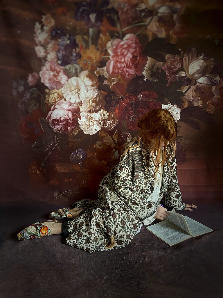 Chestnut brown and olive green fine wool dressing robe or duster coat with a design of Indienne florals. Wide sleeves, deep pockets, tassel sash. Lined in printed silk. Luxury bohemian style sustainably created in the UK from antique and vintage textiles by the Pavilion Parade studio.