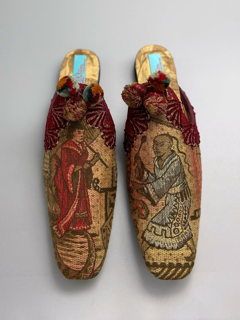 Chinoiserie Japanoiserie slipper shoes created from antique French linen and silk brocade . Embellished with antique pom pom tassels and silk chenille  braid. From the Pavilion Parade studio.