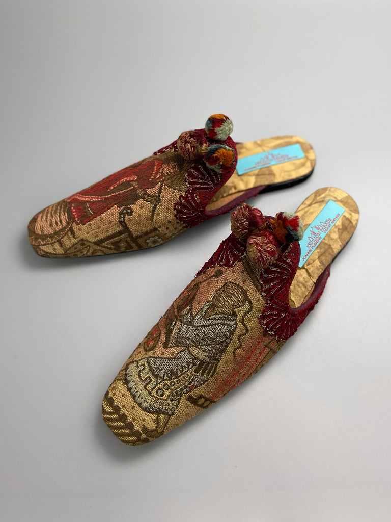 Chinoiserie Japanoiserie slipper shoes created from antique French linen and silk brocade . Embellished with antique pom pom tassels and silk chenille  braid. From the Pavilion Parade studio.