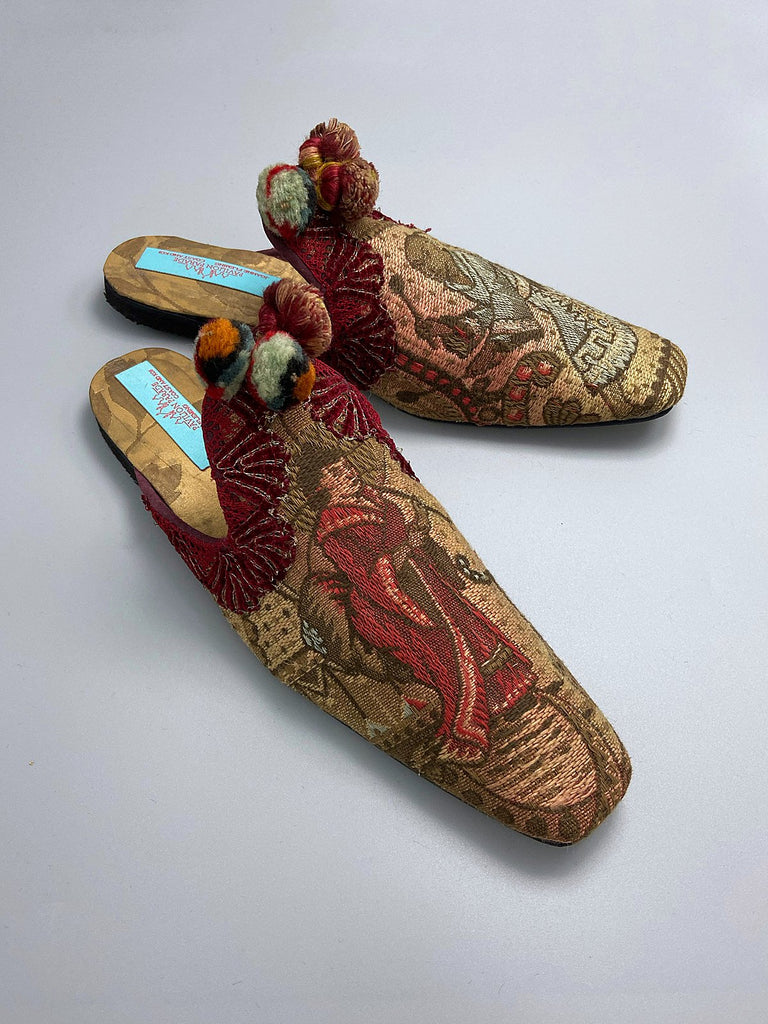 Chinoiserie Japanoiserie slipper shoes created from antique French linen and silk brocade . Embellished with antique pom pom tassels and silk chenille  braid. From the Pavilion Parade studio.