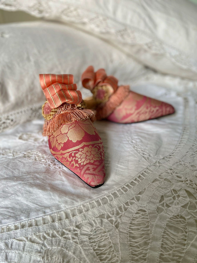 Pavilion Parade handmade shoes created from antique textiles,  available from Joanne Fleming Design. Antique kimono silk and 19th century passementerie create bohemian flat shoes in shades of pink and gold.