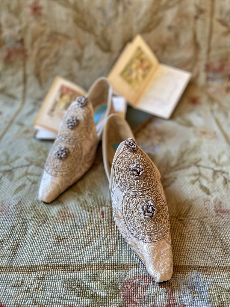 Cream and rose gold silk damask pointed toe shoes  with linen and gold metallic filigree lacework medallions. Finished with little vintage silk passementerie rosettes. Bohemian costume shoes created from antique textiles by Pavilion Parade.