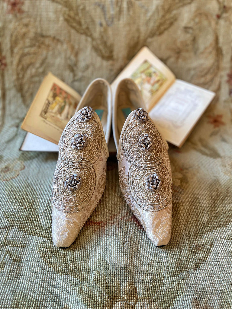 Cream and rose gold silk damask pointed toe shoes  with linen and gold metallic filigree lacework medallions. Finished with little vintage silk passementerie rosettes. Bohemian costume shoes created from antique textiles by Pavilion Parade.