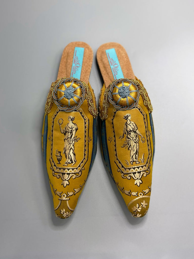 Neo classical blue and gold silk shoes with Roman Greek goddesses enclosed in lozenge cartouches encircled with laurel garlands. Created from antique textiles by Pavilion Parade enclosed in 