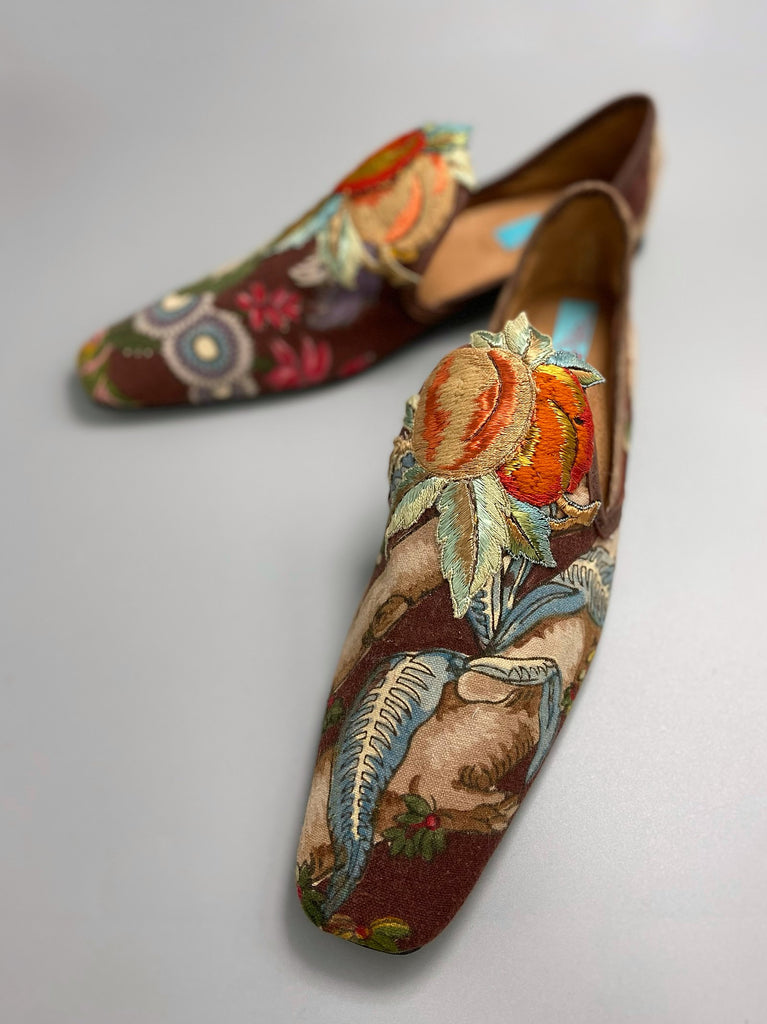 Vibrant colourful bohemian shoes created from an antique French  block printed Indienne cotton, with a design of fantastical flowers and foliage  and embroidered fruits. Sustainably made from antique textiles by Pavilion Parade