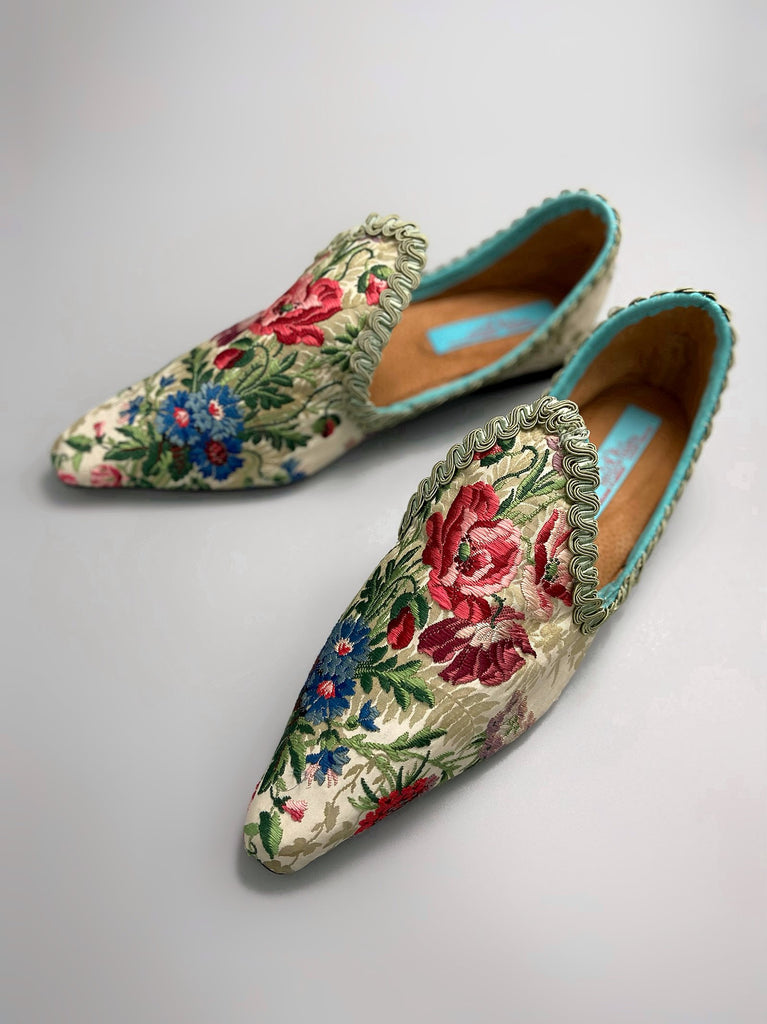 Vita embroidered floral silk brocade bohemian shoes created from antique textiles by PavilionParade. Cottage garden flowers poppies and cornflowers in reds pinks and blues on a pale sage bone ground. 